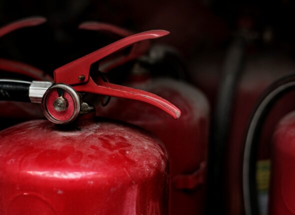 Closeup of red fire extinguishers